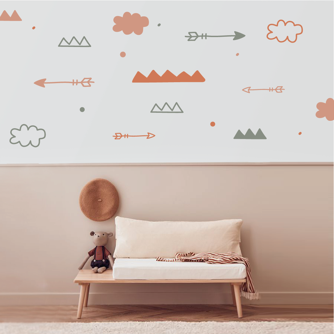 Nature-inspired wall decal with arrows, clouds, and mountains in a calming room setup.