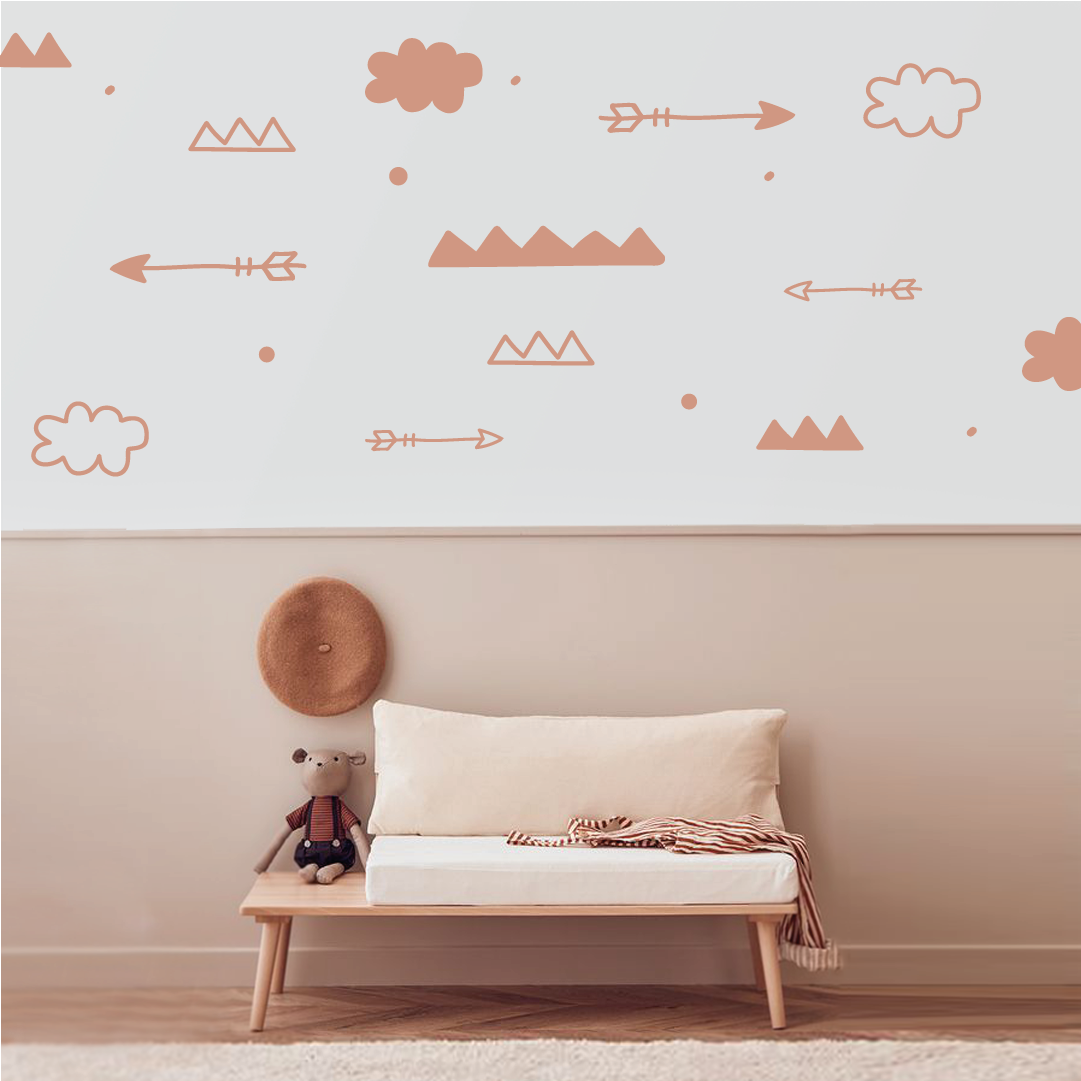 Nature-inspired wall decals with arrows and clouds in a cozy room setting.